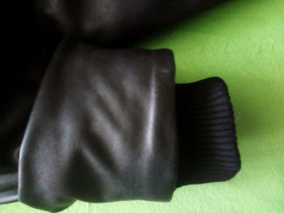 Cuff fitted into the sleeve of a leather jacket