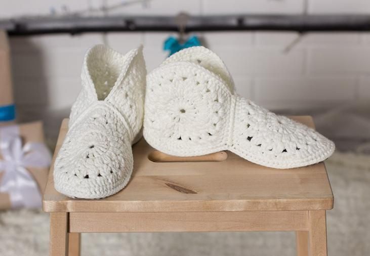 Finished white crochet house slippers on soles