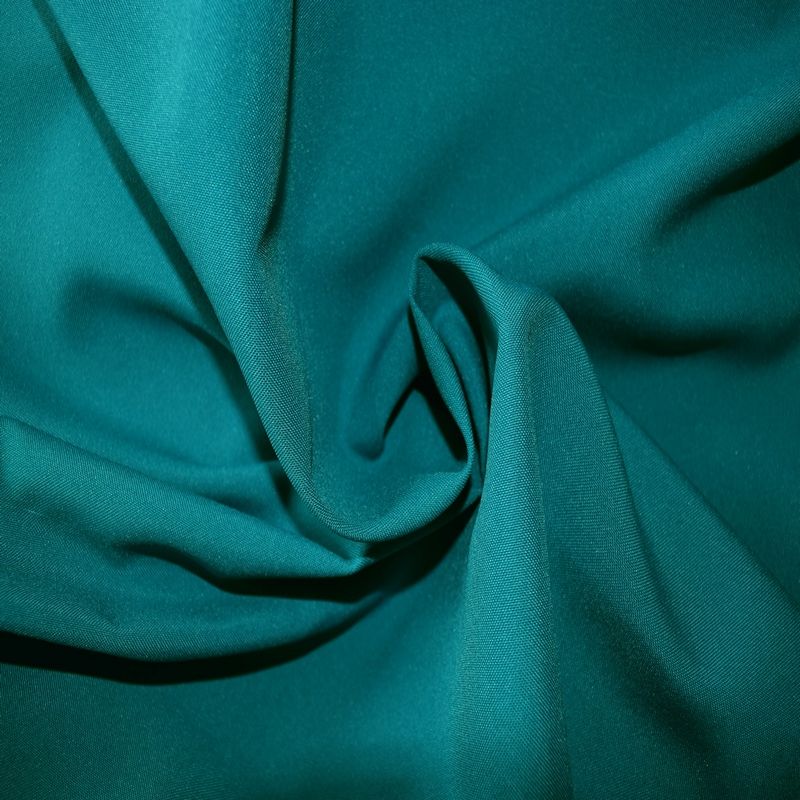 Folded gabardine fabric swatch showing weave and texture