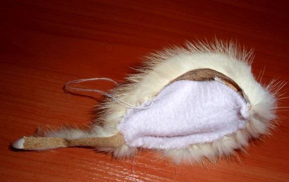 Sewn mouse head piece with a tail