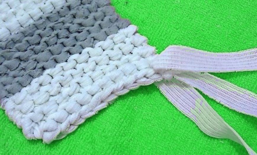 Attaching the knitted handle to the striped washcloth