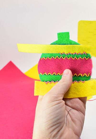 Assembled felt cat toy with a decorative strip