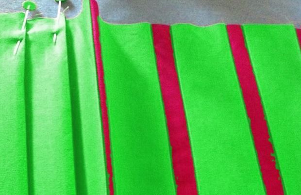 Pleats on a bag piece with raspberry ribbons sewn in