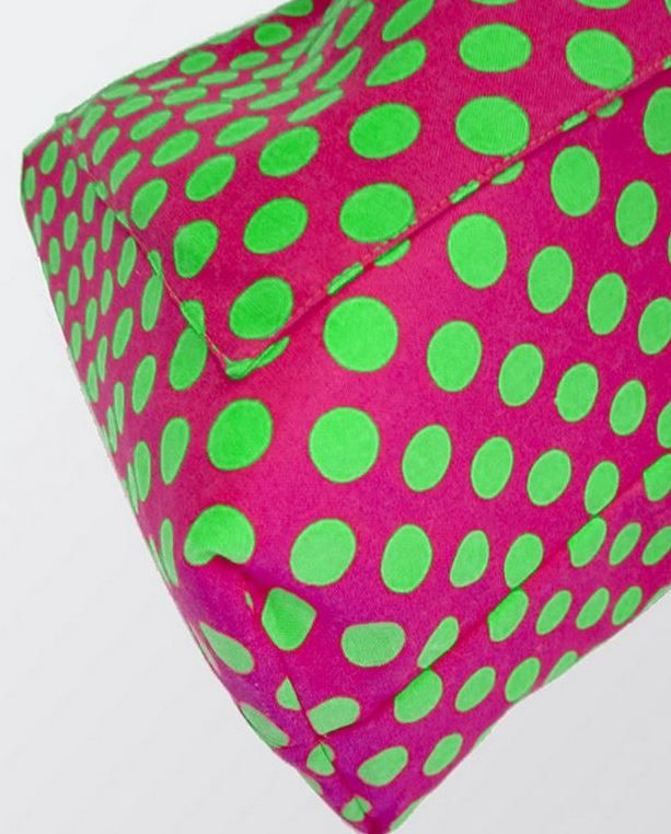 Close-up of the bag lining in pink polka dots