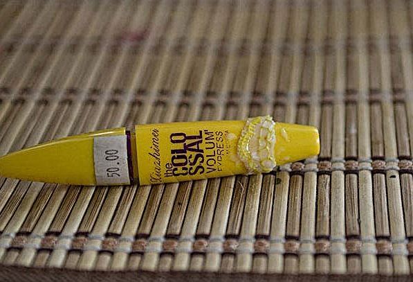 Lace scrap wrapped around a yellow tube