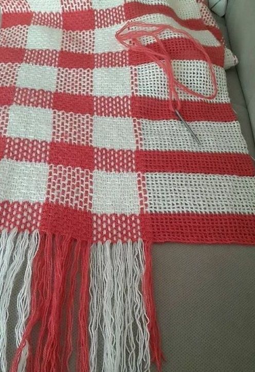 Knitted scarf with a large plaid pattern and fringe