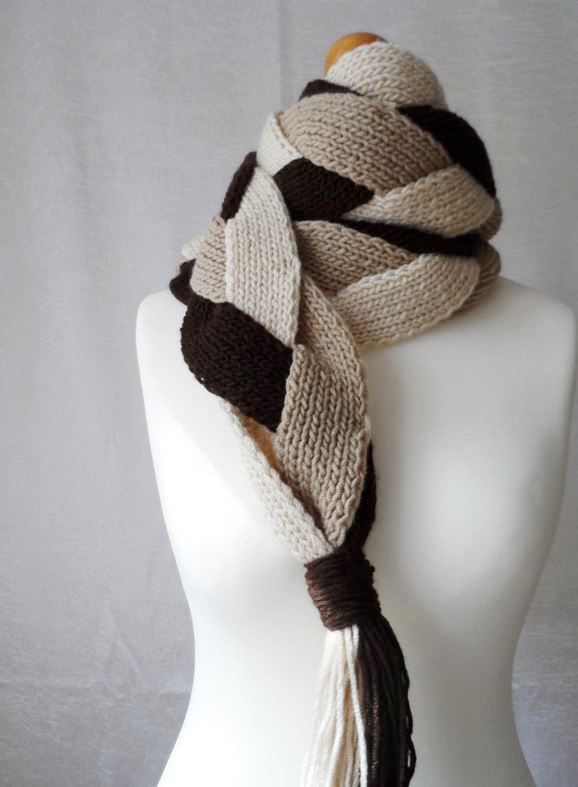 Scarf made of braided strips on a mannequin, side view