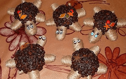 Several finished turtle magnets on a table