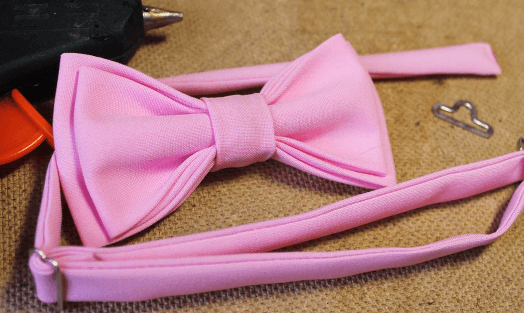 Finished pink bow tie with a strap and clasp