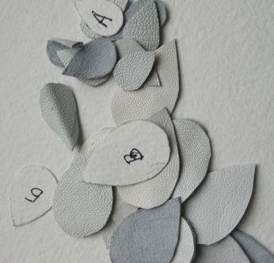 A round piece of white leather for the winter brooch