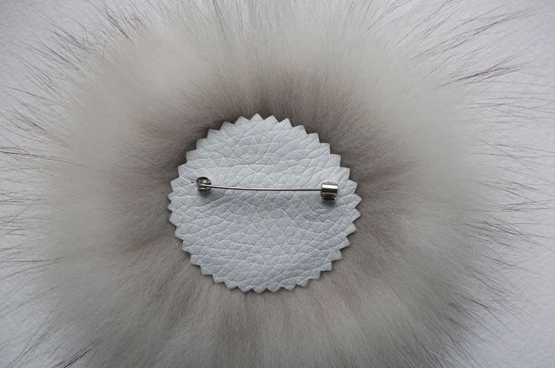 The back of the fur brooch with the pin back attached