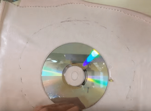 CD-диск на ткани для раскроя куклы