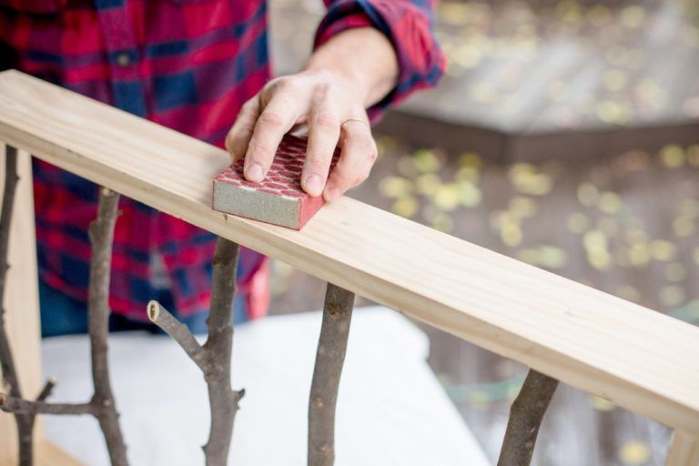 Sanding the wooden frame