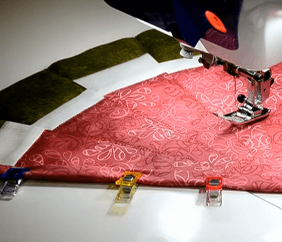 Stitching the edge of the hot pad on a sewing machine