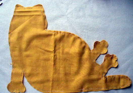 Cut-out fabric cat doorstop piece