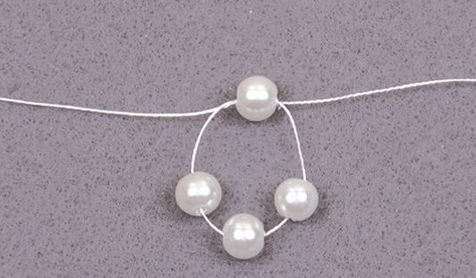 Starting to weave the collar with five pearl beads
