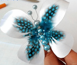 Butterfly with spread white wings on a table