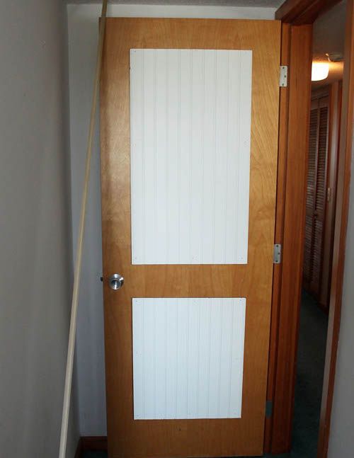 Door with plastic panels attached