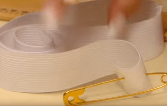 Wide white elastic and a safety pin for the skirt waistband