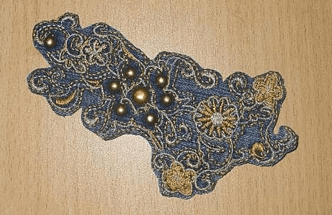 Decorative detail from a back pocket placed on the lower apron section