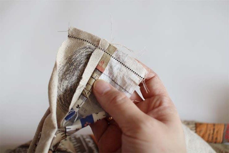 Turning or hand-sewing the edge of a bag handle