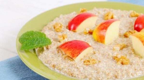 Bowl of porridge with apple slices