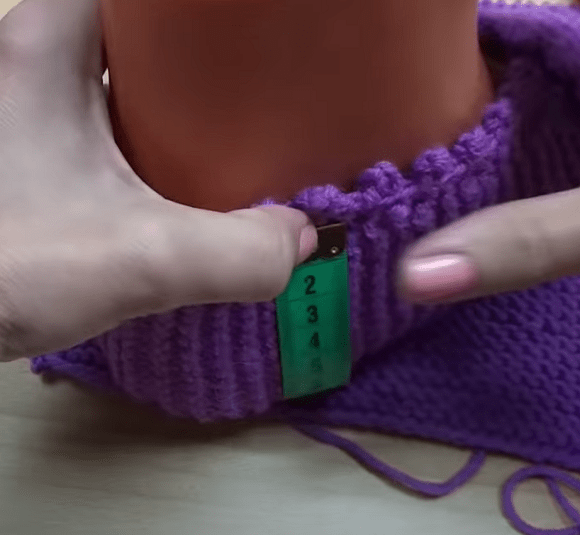 Measuring the footie width from the top edge across the sole