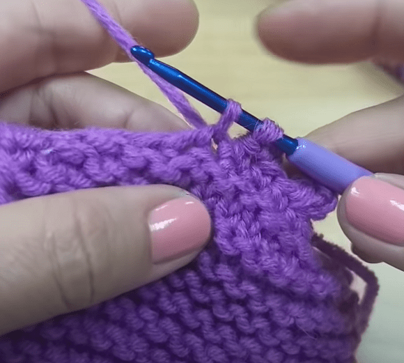 Joining the footie edge with single crochet stitches
