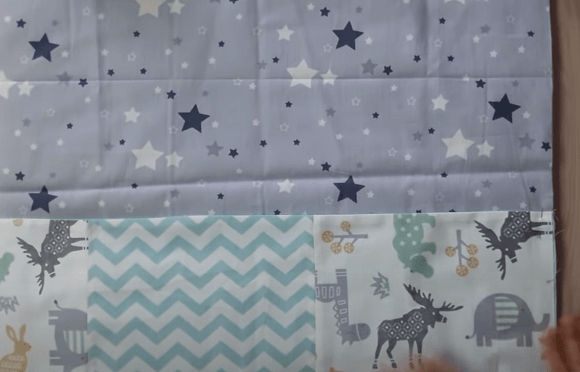 Pocket section pinned to the padded fabric base