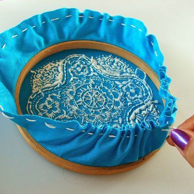 Pulling the thread to gather the fabric