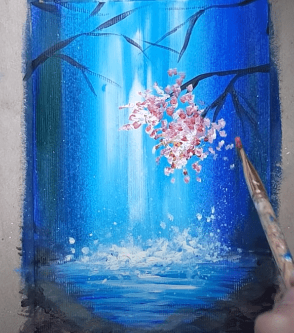 Цветущая ветвь на картине с водопадом