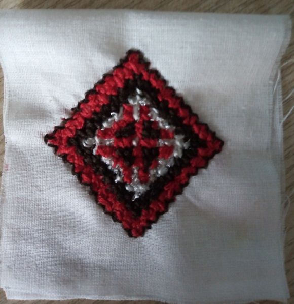 Square pincushion with crocheted edging