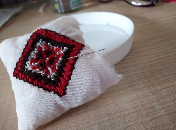 Hand-finishing a square pincushion