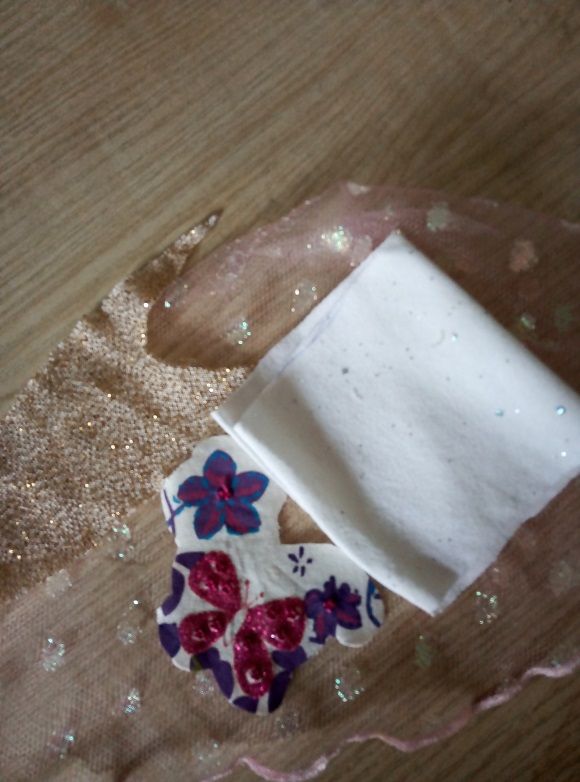 Fabric pincushion with butterfly applique