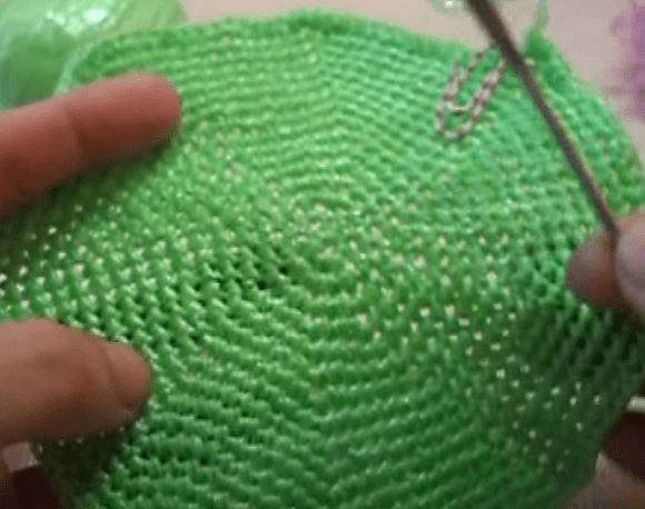 Smooth round side of the washcloth crocheted in stitches
