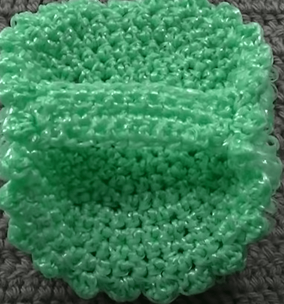 Continuing to crochet elongated loops on the second side of the washcloth