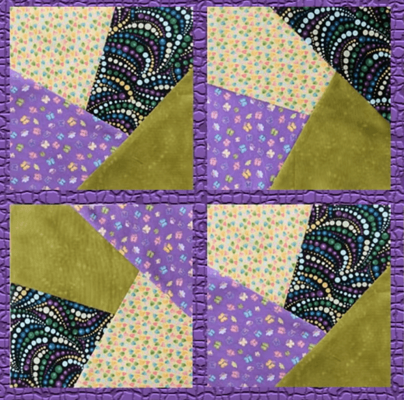 Finished fabric mosaic block with a purple border