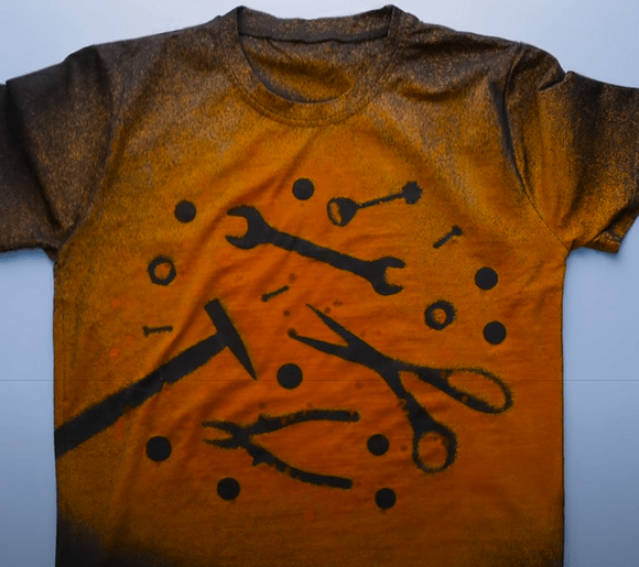 Tools arranged on a black t-shirt