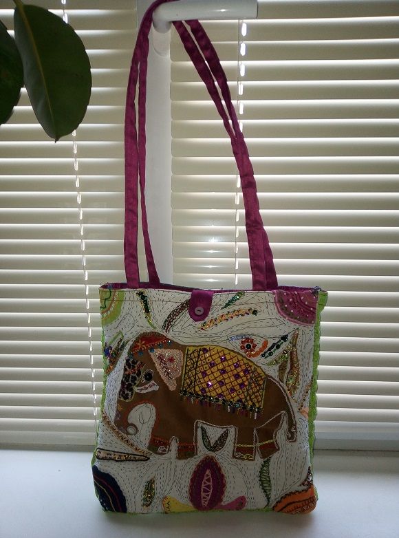 A handmade summer bag featuring an elephant appliqué
