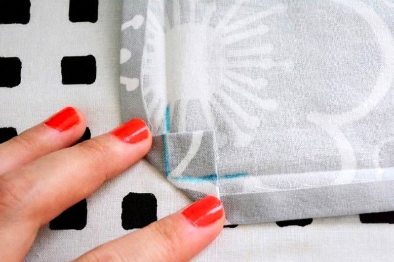 A fabric corner with a marked fold line and hem
