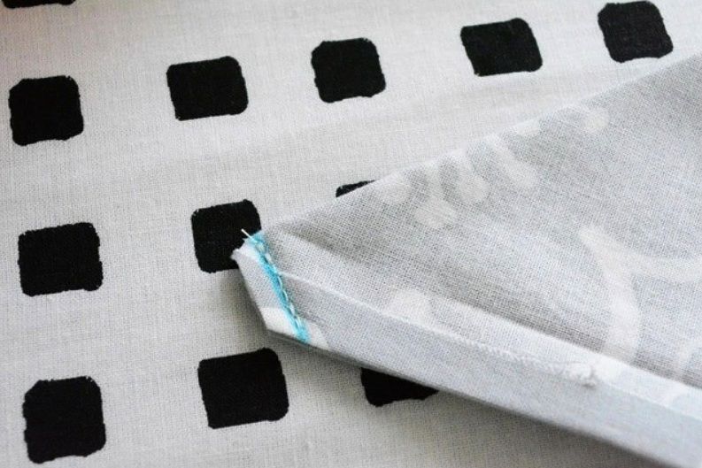 A fabric corner after stitching along the diagonal