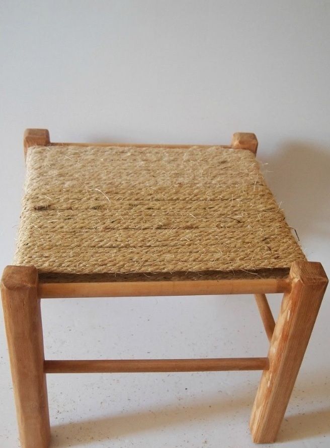 Wooden stool with a seat tightly wrapped in natural rope