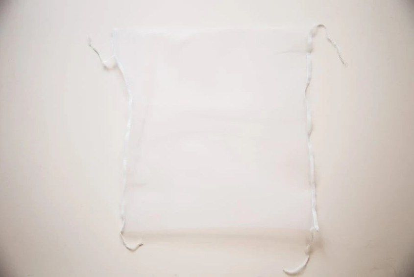 Finished white mesh drawstring bag