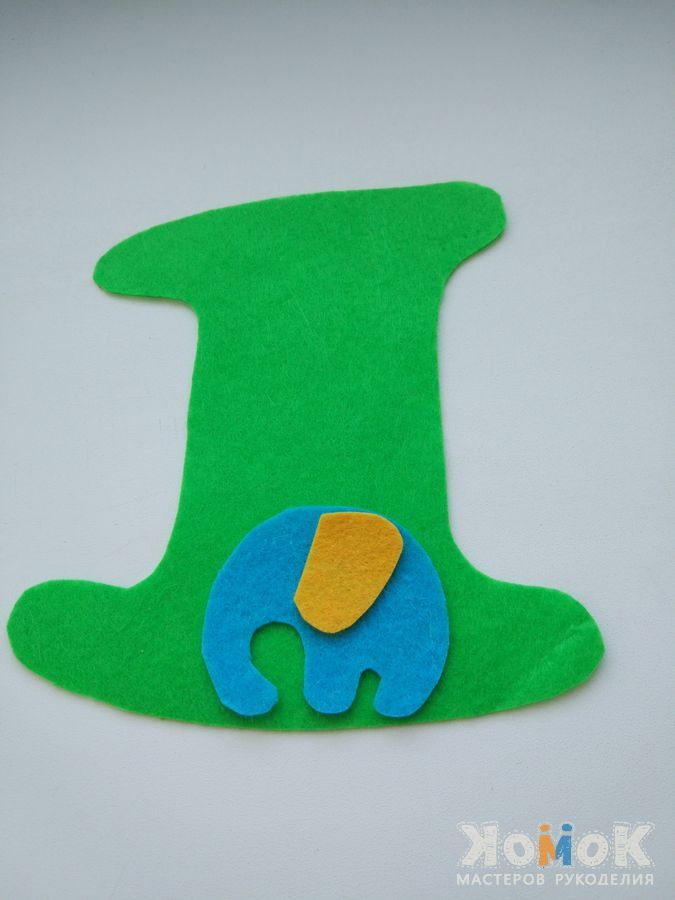 Elephant appliqué on a green felt number