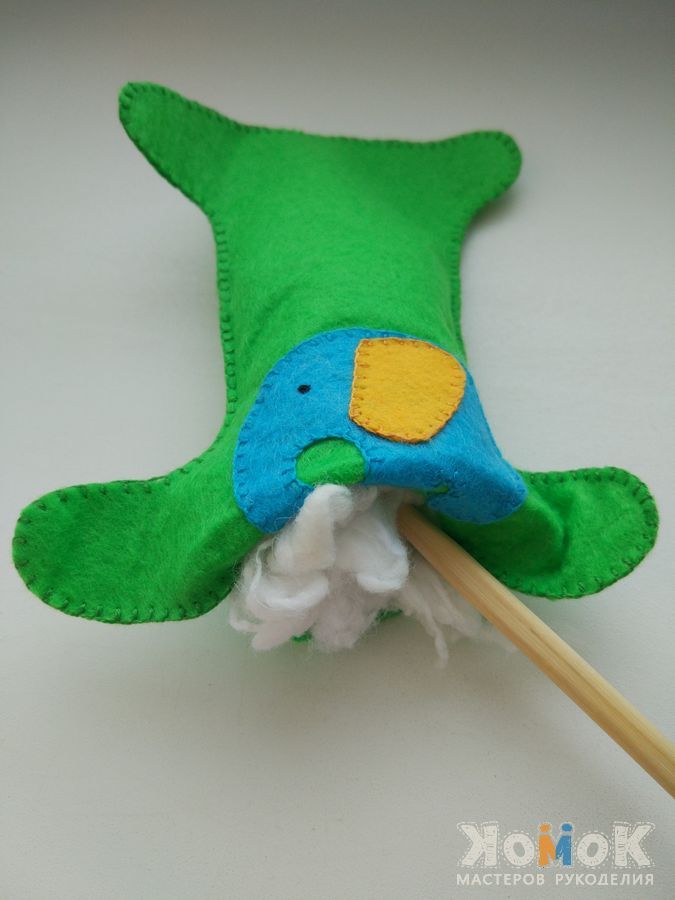 Stuffing an educational felt number with polyester filling