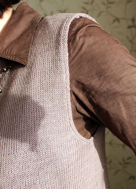 Sleeveless knitted vest with a neatly shaped armhole