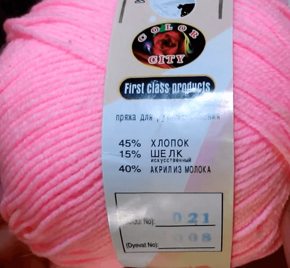 Pink yarn with a label listing cotton, silk, and acrylic
