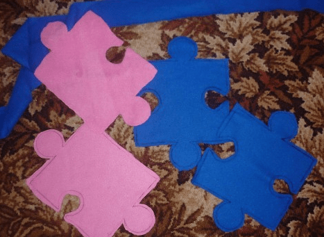 Pink and blue pieces of the soft puzzle mat