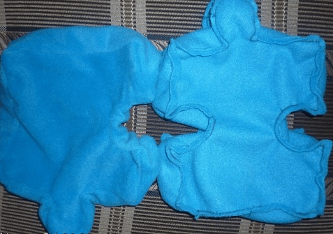 Two blue soft puzzle mat pieces with an opening for stuffing