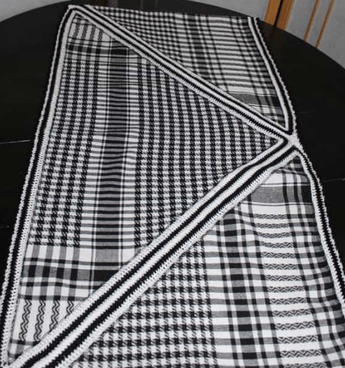 Stole made from a plaid scarf, laid out flat